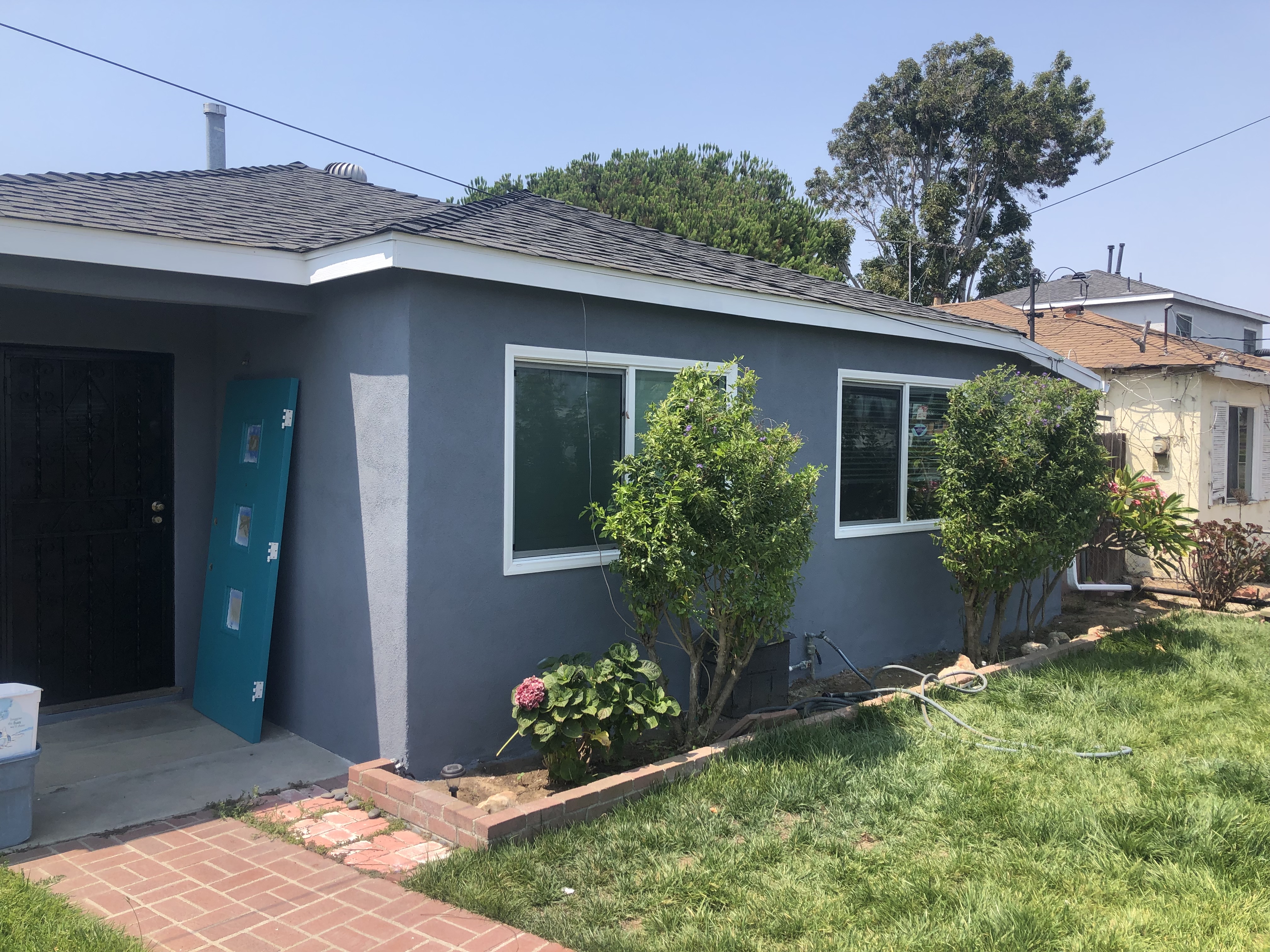 SF Construction and Painting project: gray home exterior with white trim